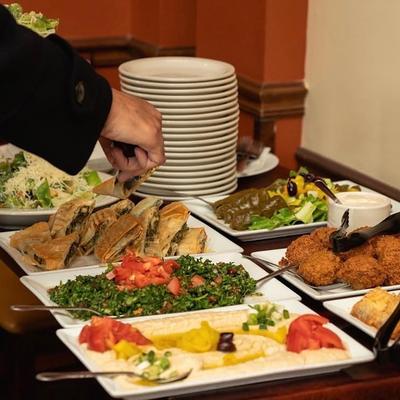 Various appetizer dishes served on the buffet-style table.