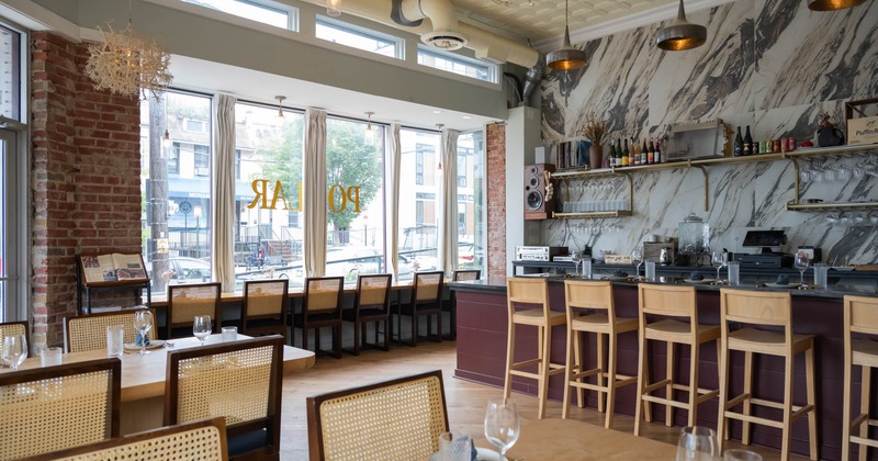 Interior, seating area with a bar on the right