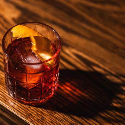 Negroni cocktail on a wooden table.