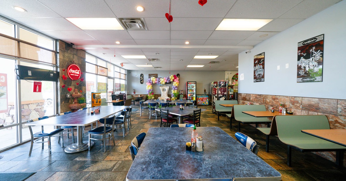 Inside, seating area with wall balloon decoration