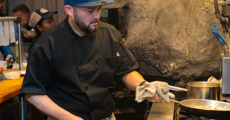 Chef frying food in a pan