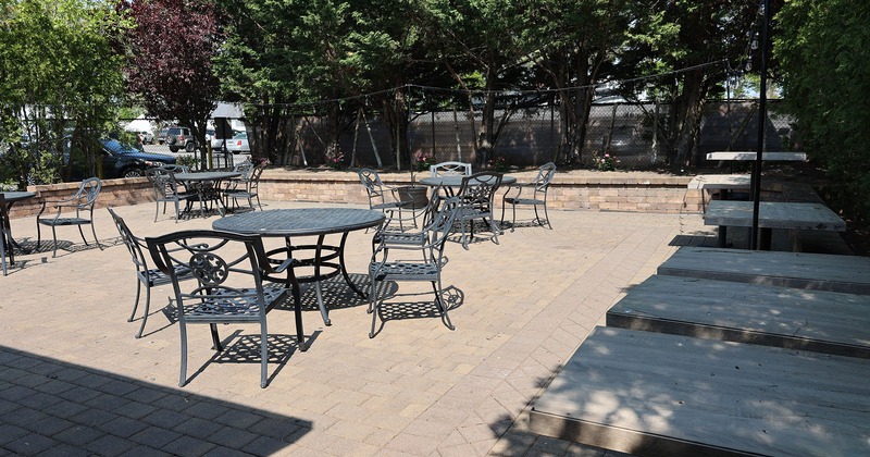 Exterior, patio with tables and chairs