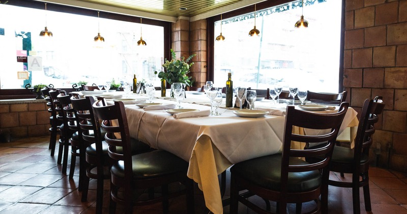 Interior, a long table ready for guests