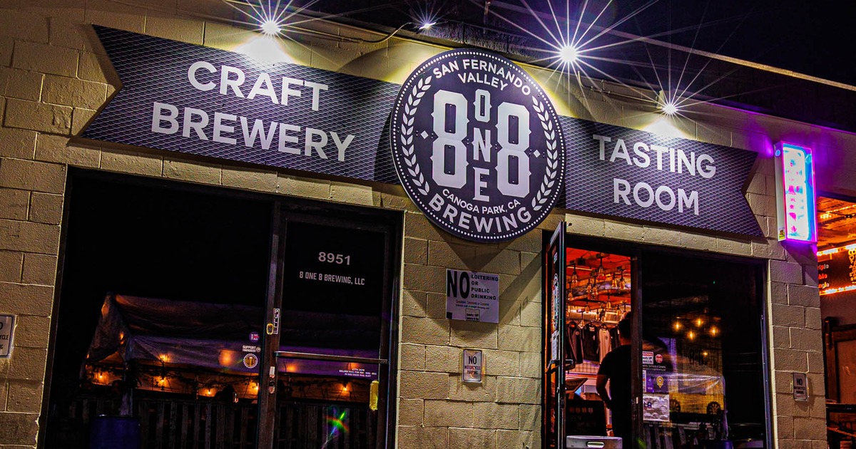 Storefront featuring warehouse-style seating with signage and entrance