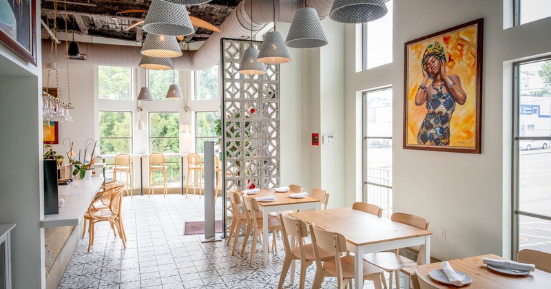 Interior, open space near the windows with tables and chairs