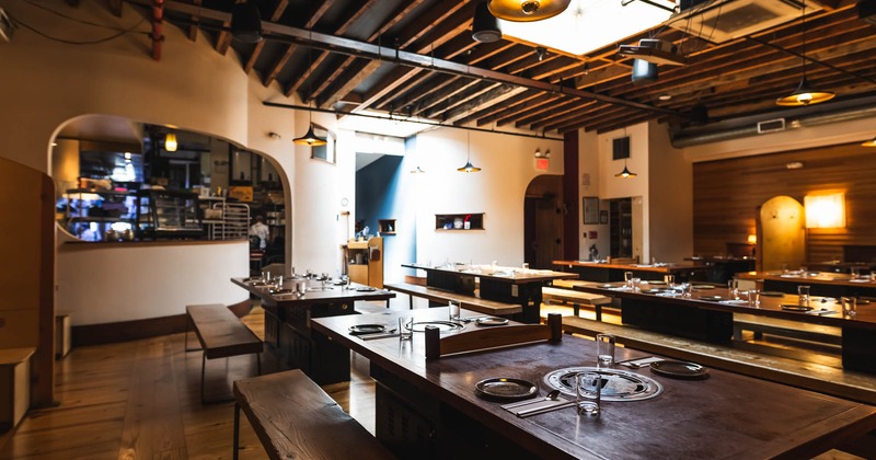Room with Korean barbecue tables and benches