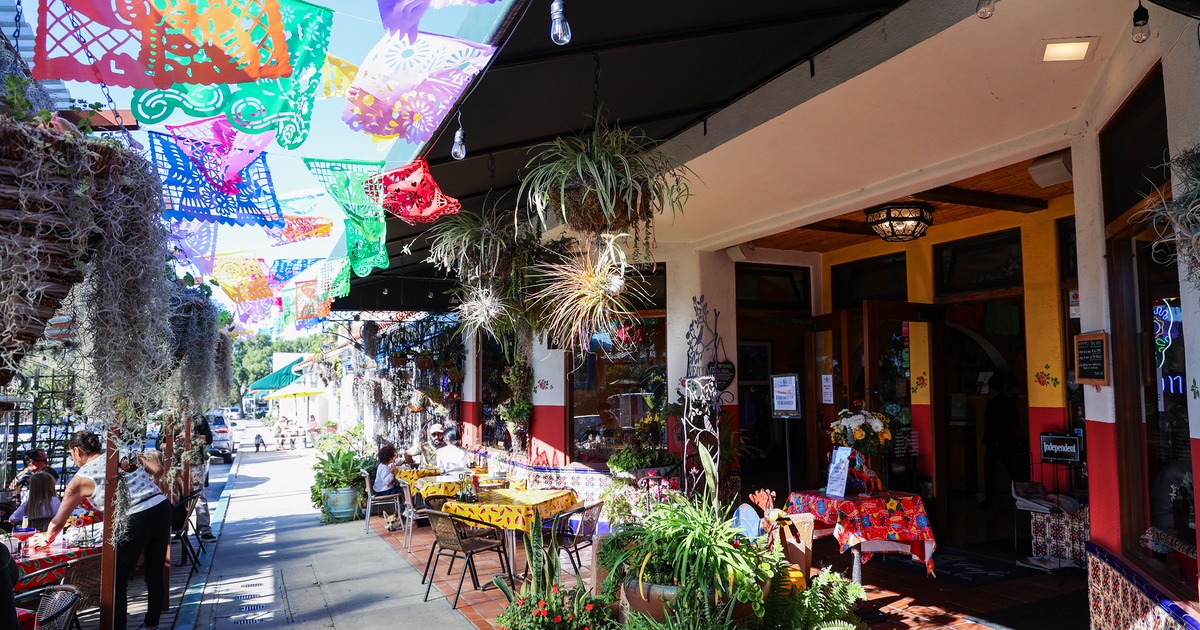 Outdoor seating area by the restaurant entrance