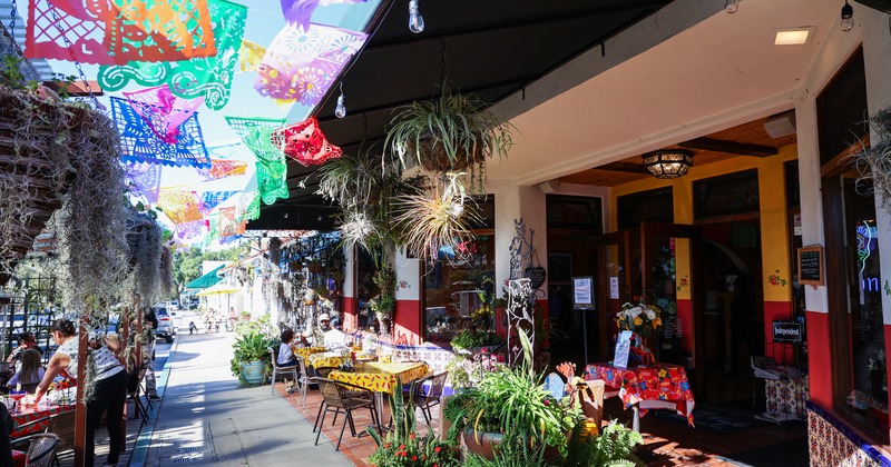 Outdoor seating area by the restaurant entrance