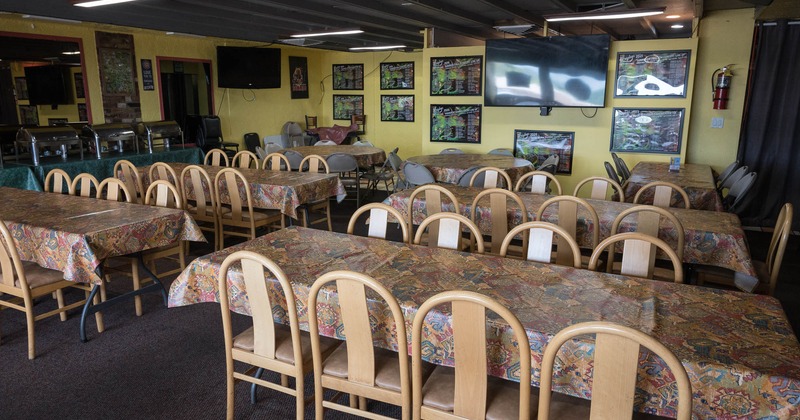 Interior, tables and chairs in seating area