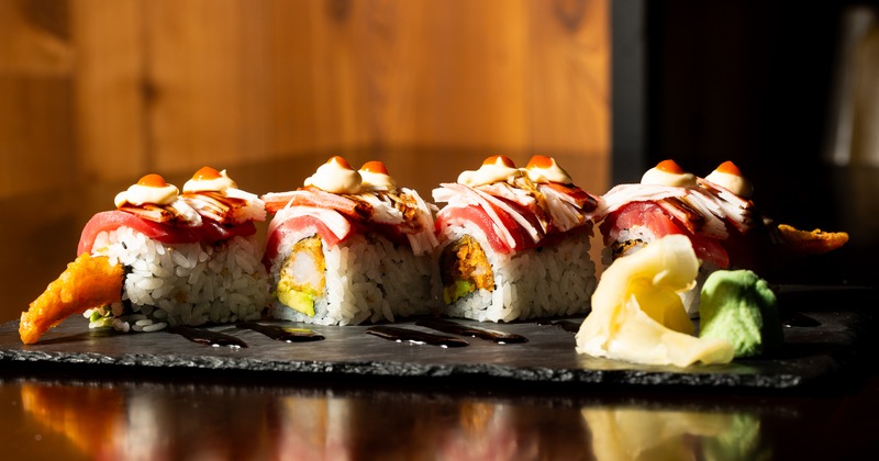 Tokyo Roll  topped with fresh tuna, crab stick, mayo, hot sauce and eel sauce