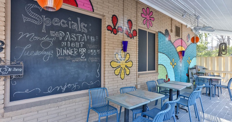 Exterior, patio with tables and chairs
