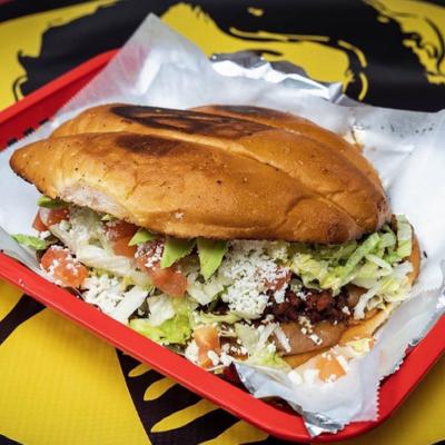 Torta with various fillings, served on a tray.