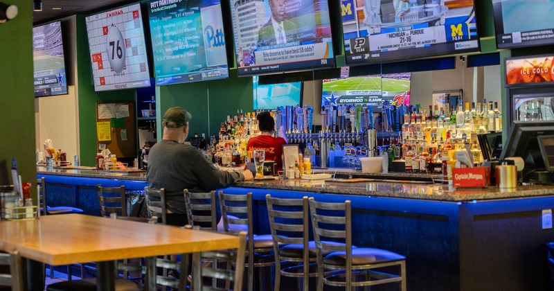Interior, bar, bar stools, gust seating, tv screen above