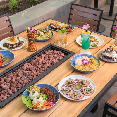 Various food on the fire pit table.