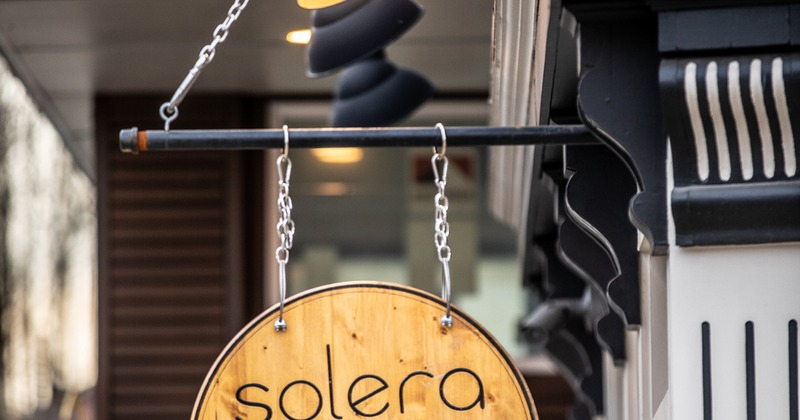 Exterior, side view, sign above the entrance