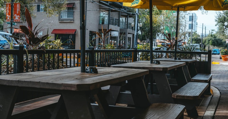 Exterior, conjoined wooden tables and benches