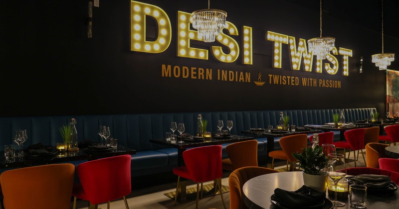 Interior seating area with booths, chairs and tables