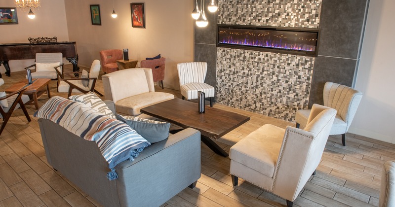 A sofa and armchairs in the sitting area