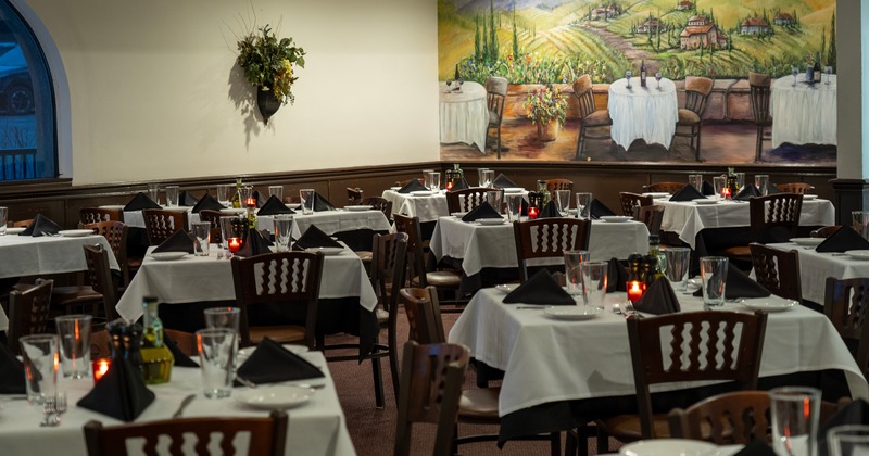 Cozy interior dining area with set tables, perfect for any special occasion