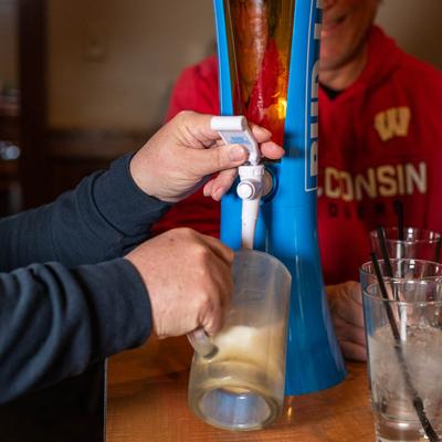 A bartender pouring beer.