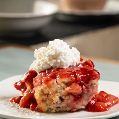 Strawberry Shortcake topped with whipped cream.