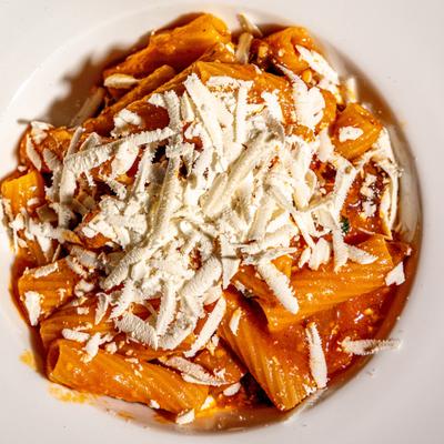 Rigatoni pasta with eggplant and ricotta cheese in light tomato sauce.