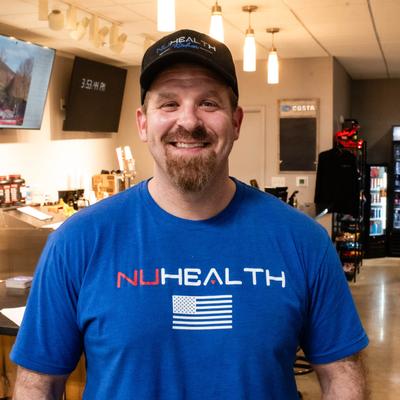 A staffer in the restaurant setting, headshot.