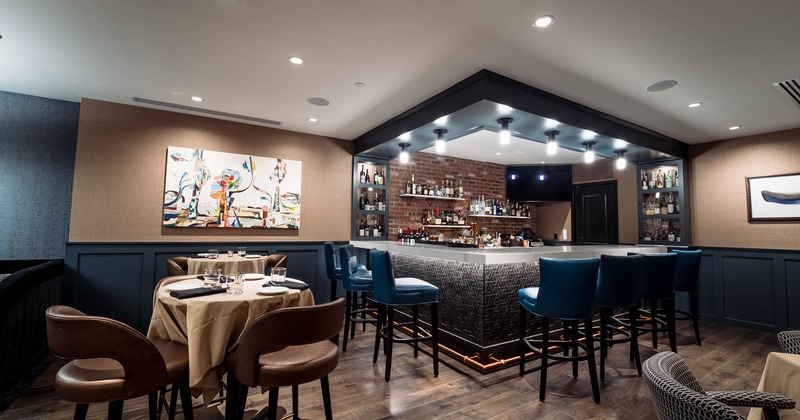 Bar area with bar stools and a bar table