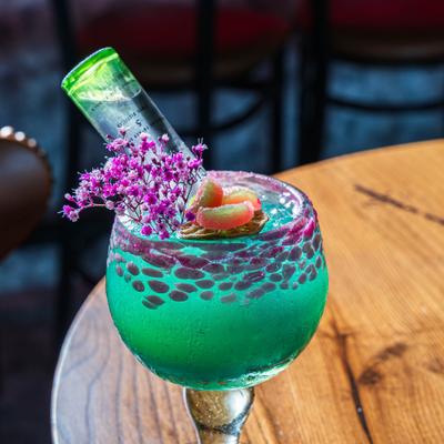 Ciroc Margarita with small bottle of vodka inserted into a glass.