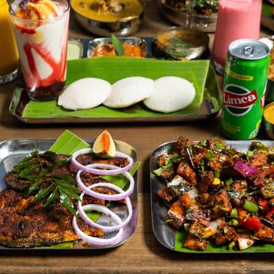 Various food and drinks on the table.