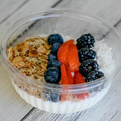 Acai Bowl, with Greek yogurt, coconut shavings, berries, and granola.