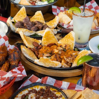 Jambalaya served in a skillet with toasted bread triangles.