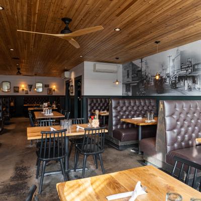 Dining room with a mix of booth and high table seating.