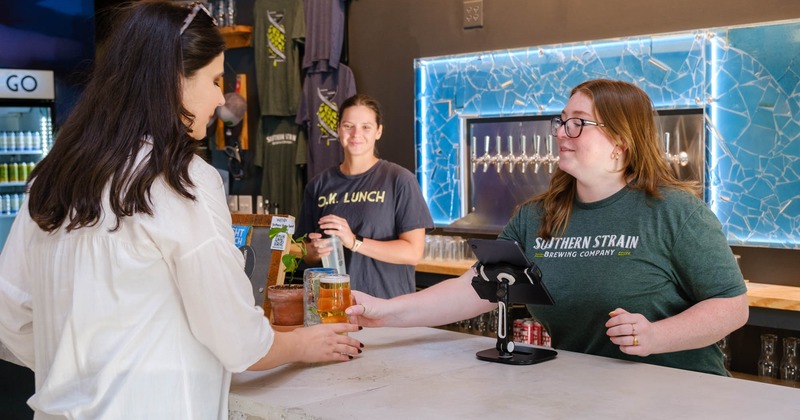 People interacting at the bar