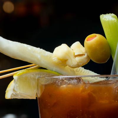 Bloody Mary cocktail with various garnishes, close-up.