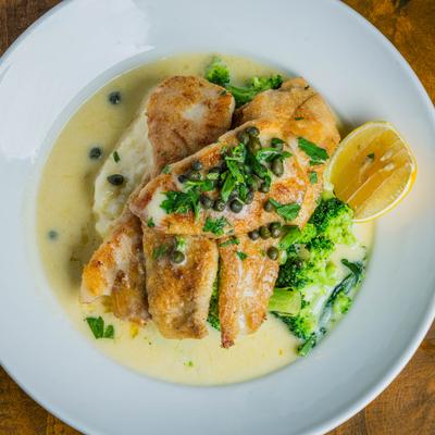 Petrole sole plated with capers and lemon sauce.