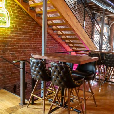 Interior, lined up tables and chairs for guests