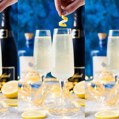 French 75 garnished with lemon slices.