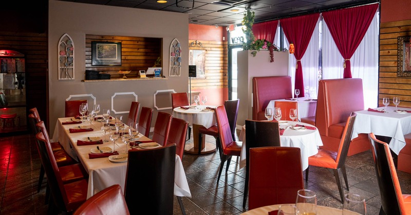 Interior, set tables, chairs, windows, curtains, various curiosities, display cases