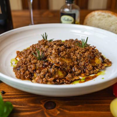 Ravioli with Bolognese sauce.