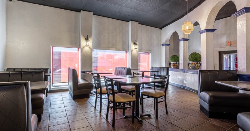 Interior, spacious seating area with windows in the back