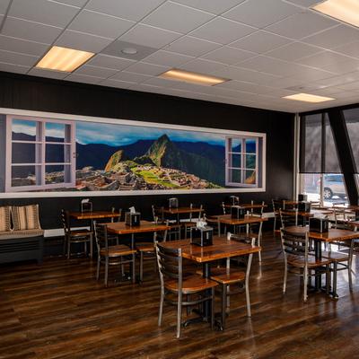 The interior of the restaurant, tables and chairs.