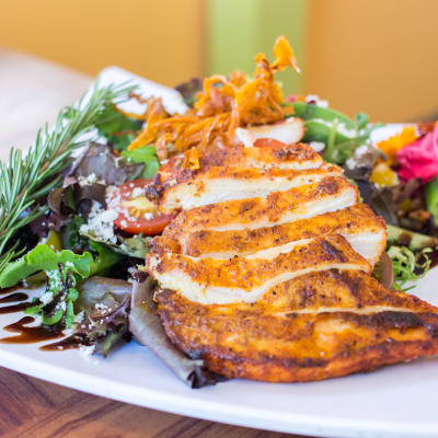Sliced grilled chicken with vegetables.