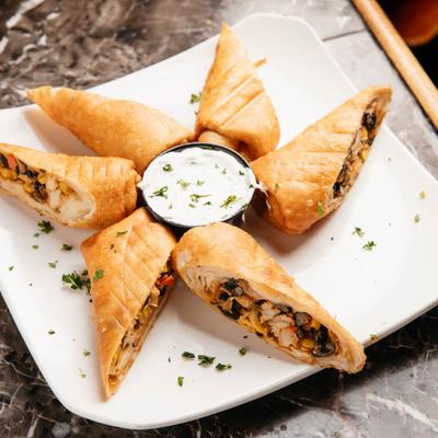 Stuffed egg rolls  served with Grecian Dip