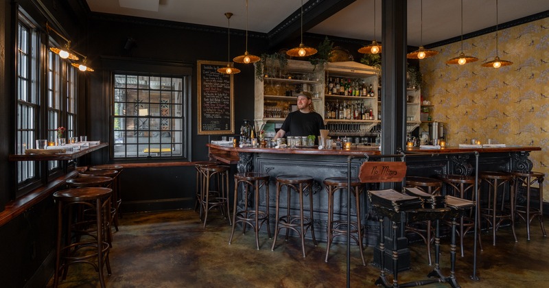 Bar, bar stools, barmen behind