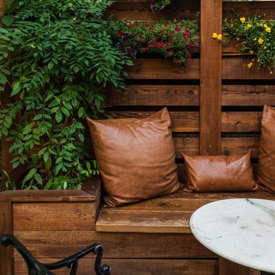 Wooden bench with pillows.