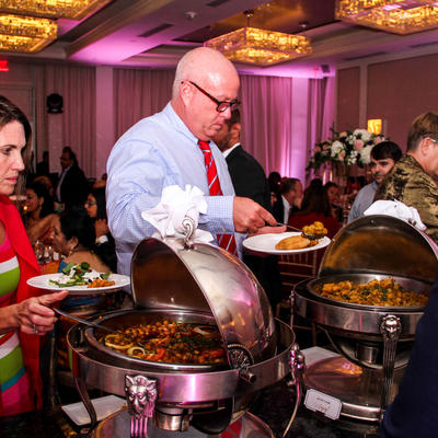Guests taking food from the catering table