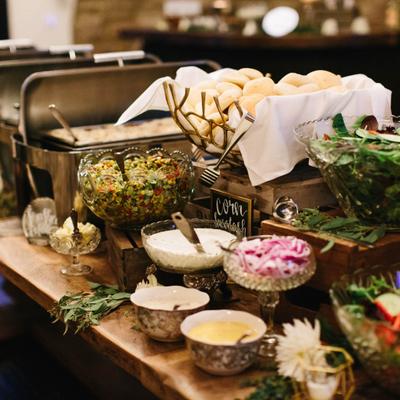 Food in serving containers on display.