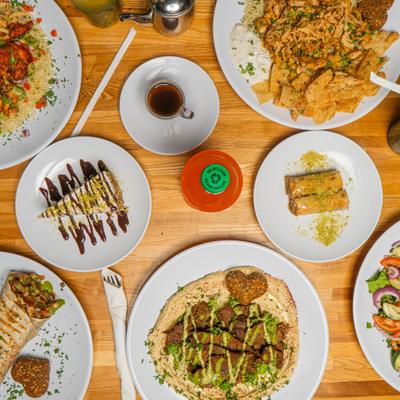 Overhead view of the variety of dishes served on the table alongsode dinks.