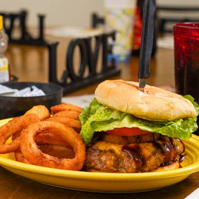 Texas Burger served with onion rings.